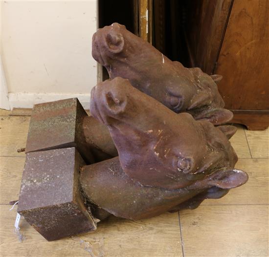 A pair of cast iron horses heads Width of base 20cm